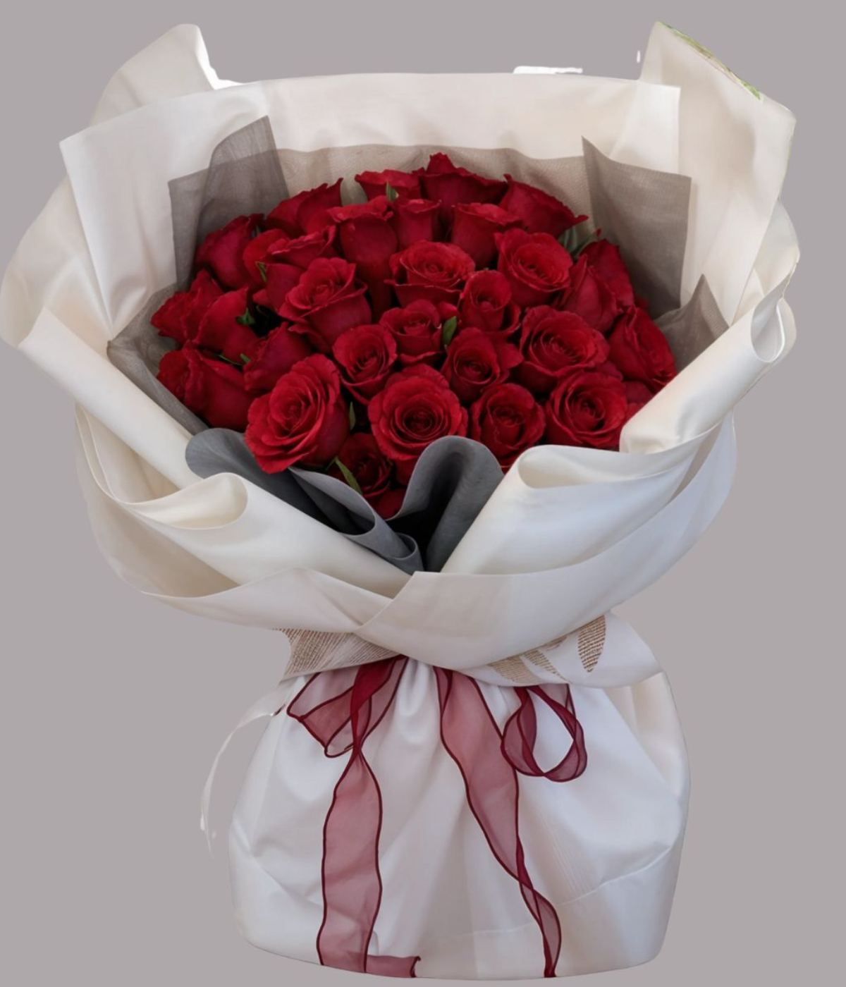 Ruby Petal Bliss – luxury bouquet of fresh red roses wrapped in white paper with red ribbon – Petal Frost flower shop