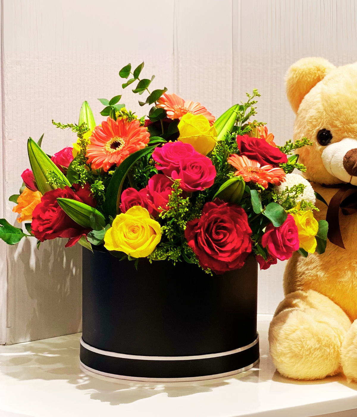 Collection of flowers with Teddy Bear