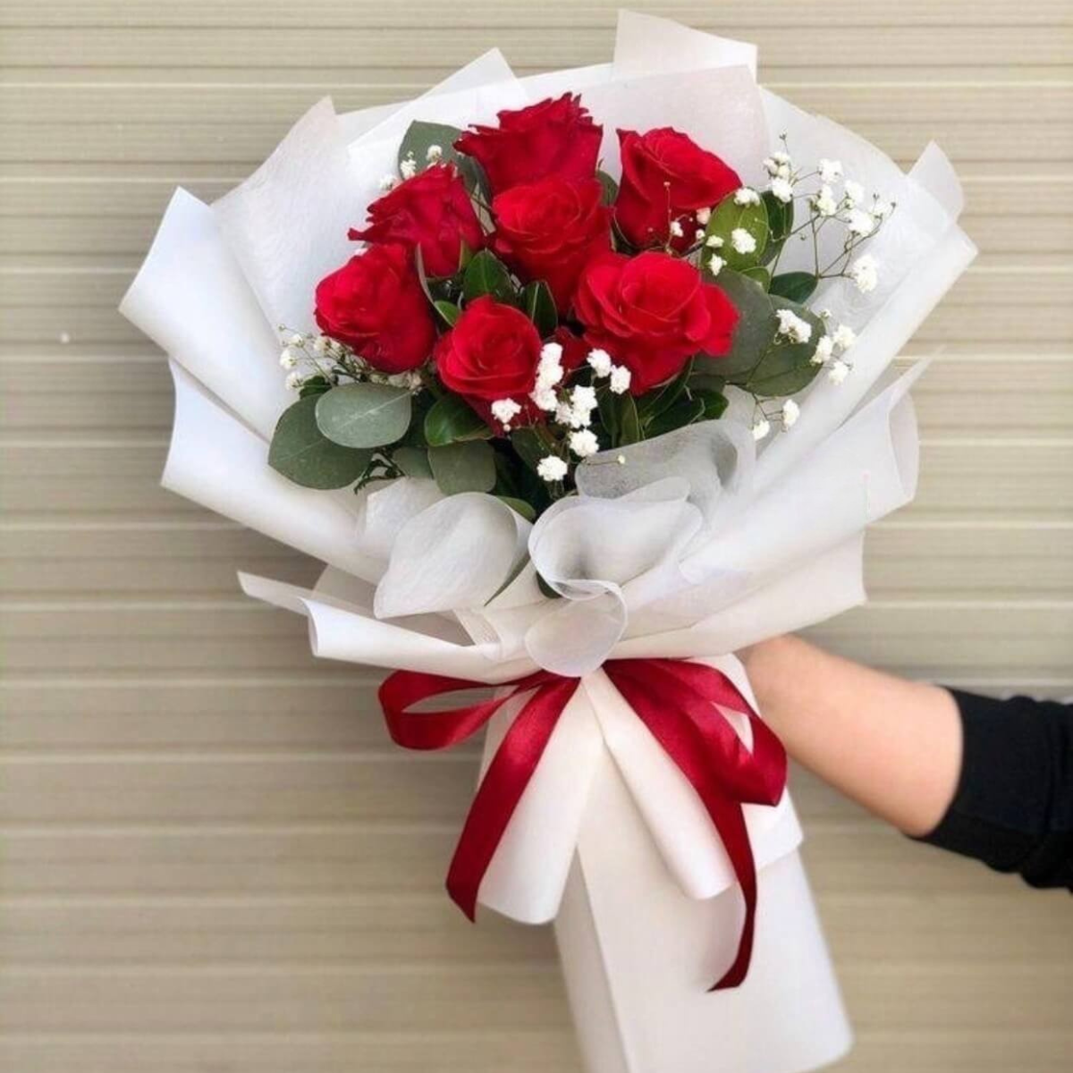 Lover’s Valentine Delight bouquet – 7 premium red roses with eucalyptus – Petal Frost Dubai