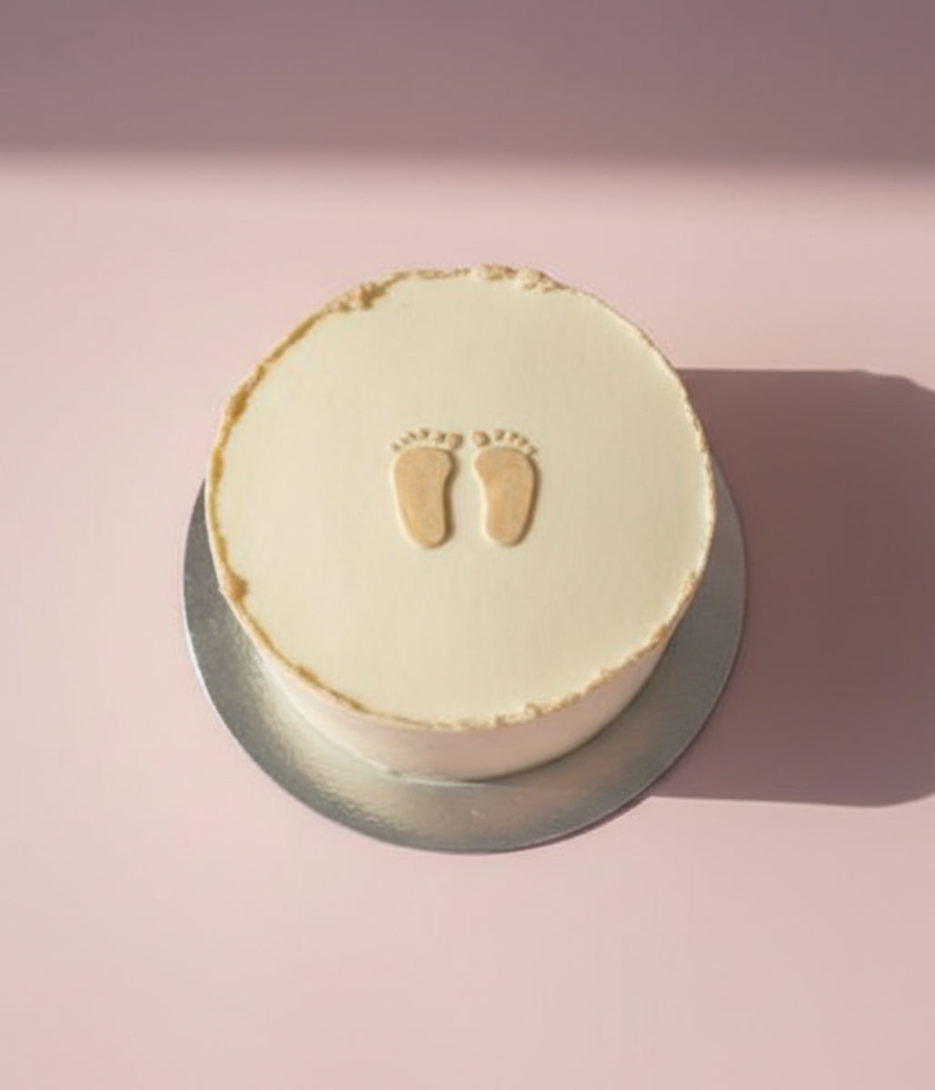 Minimalist Baby Footprints Cake