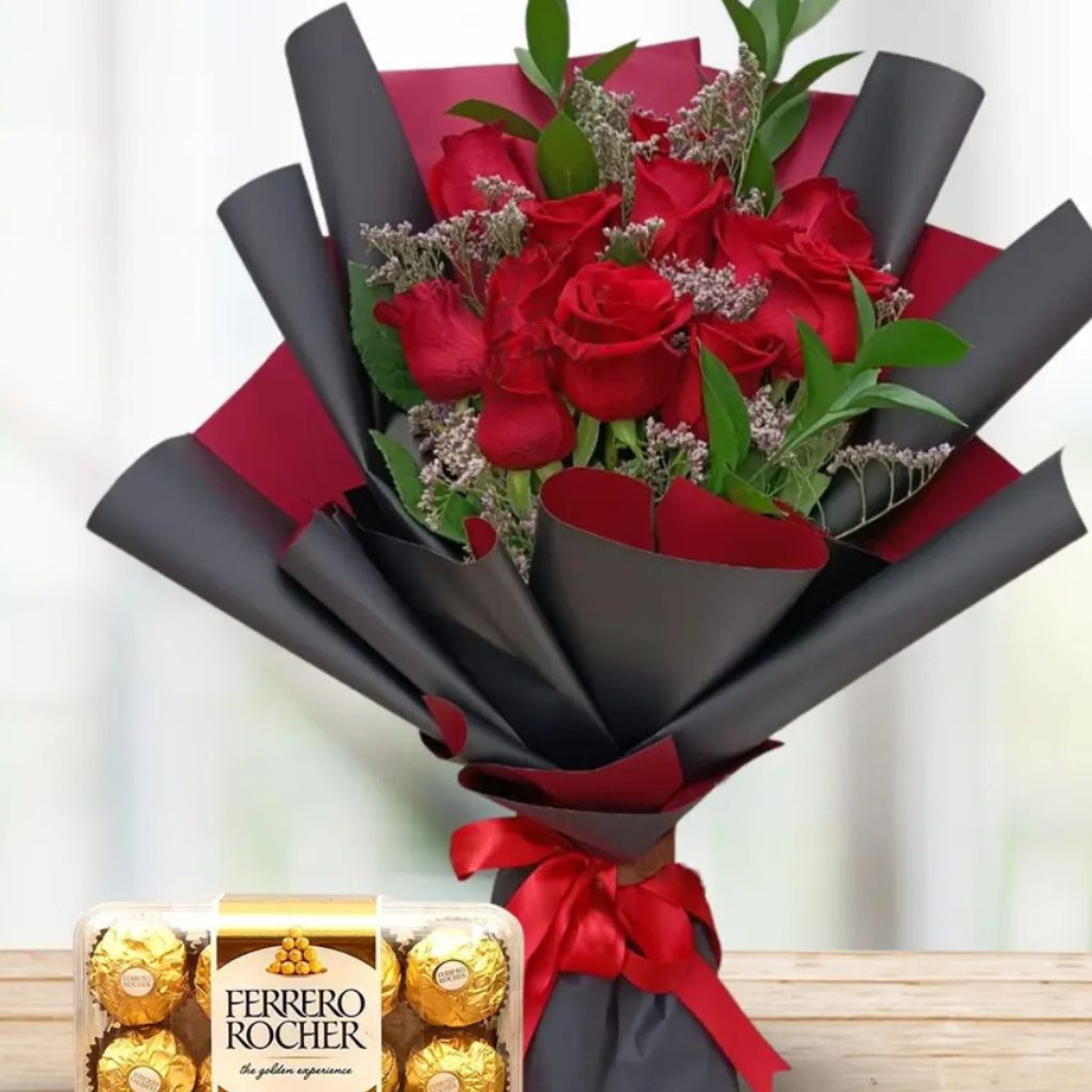 Sweet Affection Bundle a handpicked flower bouquet of red roses with green eucalyptus, wrapped with black and red paper, accompanied by a Ferrero Rocher chocolate box – Petal Frost flower shop