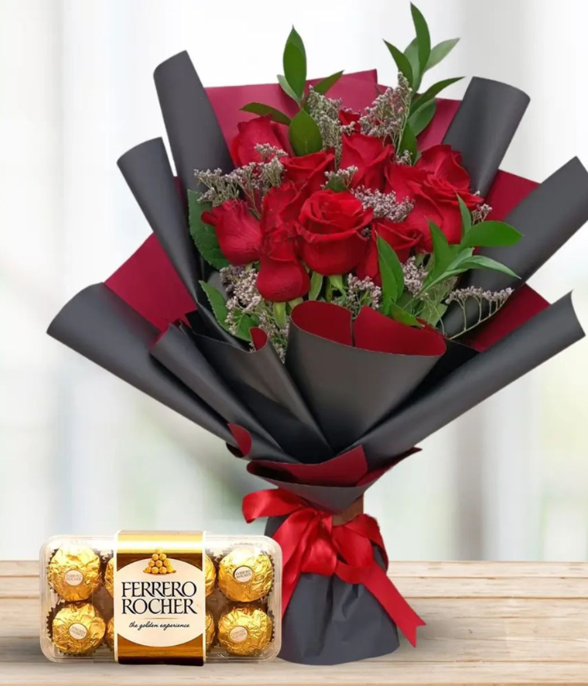 Sweet Affection Bundle a handpicked flower bouquet of red roses with green eucalyptus, wrapped with black and red paper, accompanied by a Ferrero Rocher chocolate box – Petal Frost flower shop