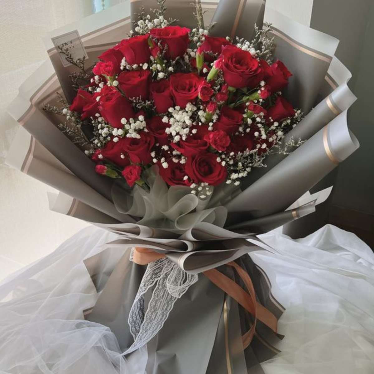 Valentine’s Whisper Bouquet – 25 red roses with eucalyptus – Petal Frost Dubai