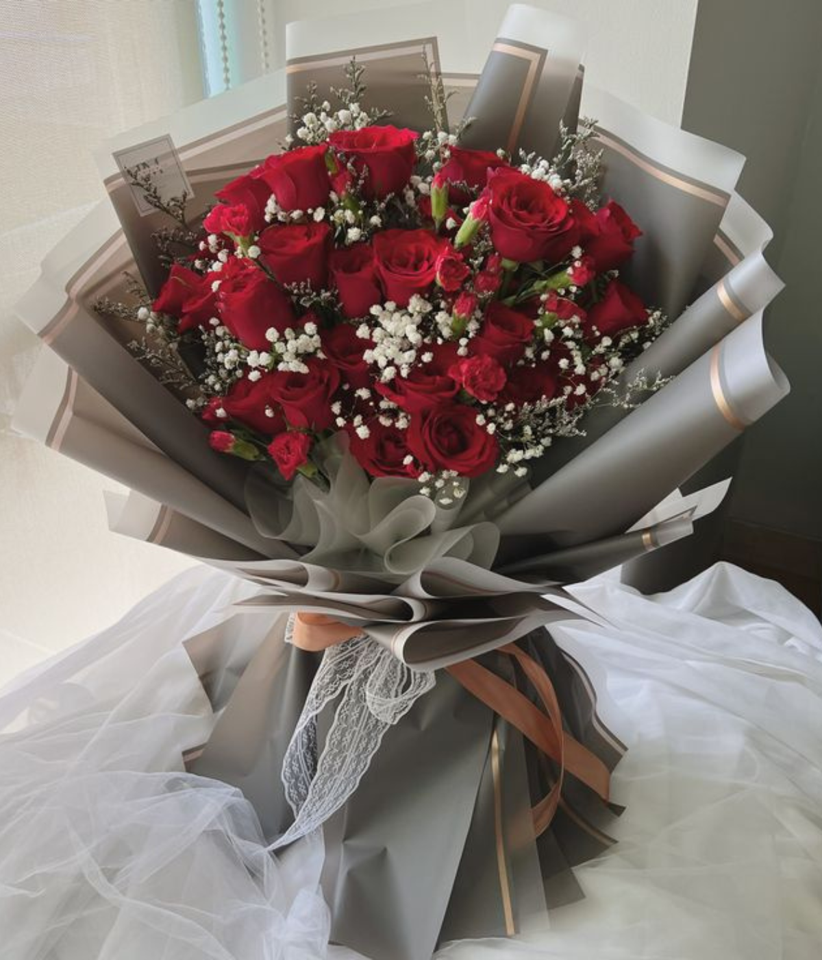 Valentine’s Whisper Bouquet – 25 red roses with eucalyptus – Petal Frost Dubai