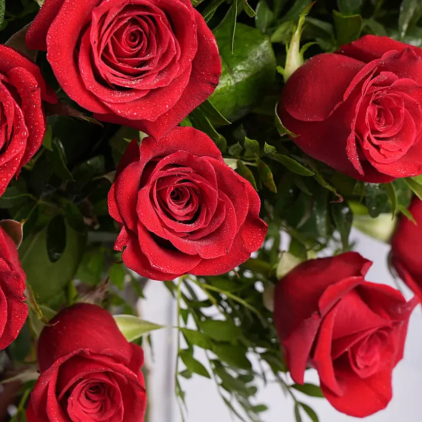 Ravishing 100 Red Roses In Glass Vase